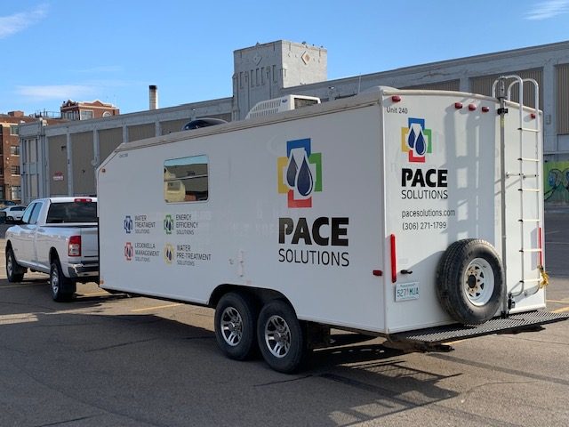 Pace Solutions mobile water treatment trailer - side view with truck